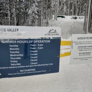 Opening hours sign posted on front gate of Hemlock Valley Transfer Station